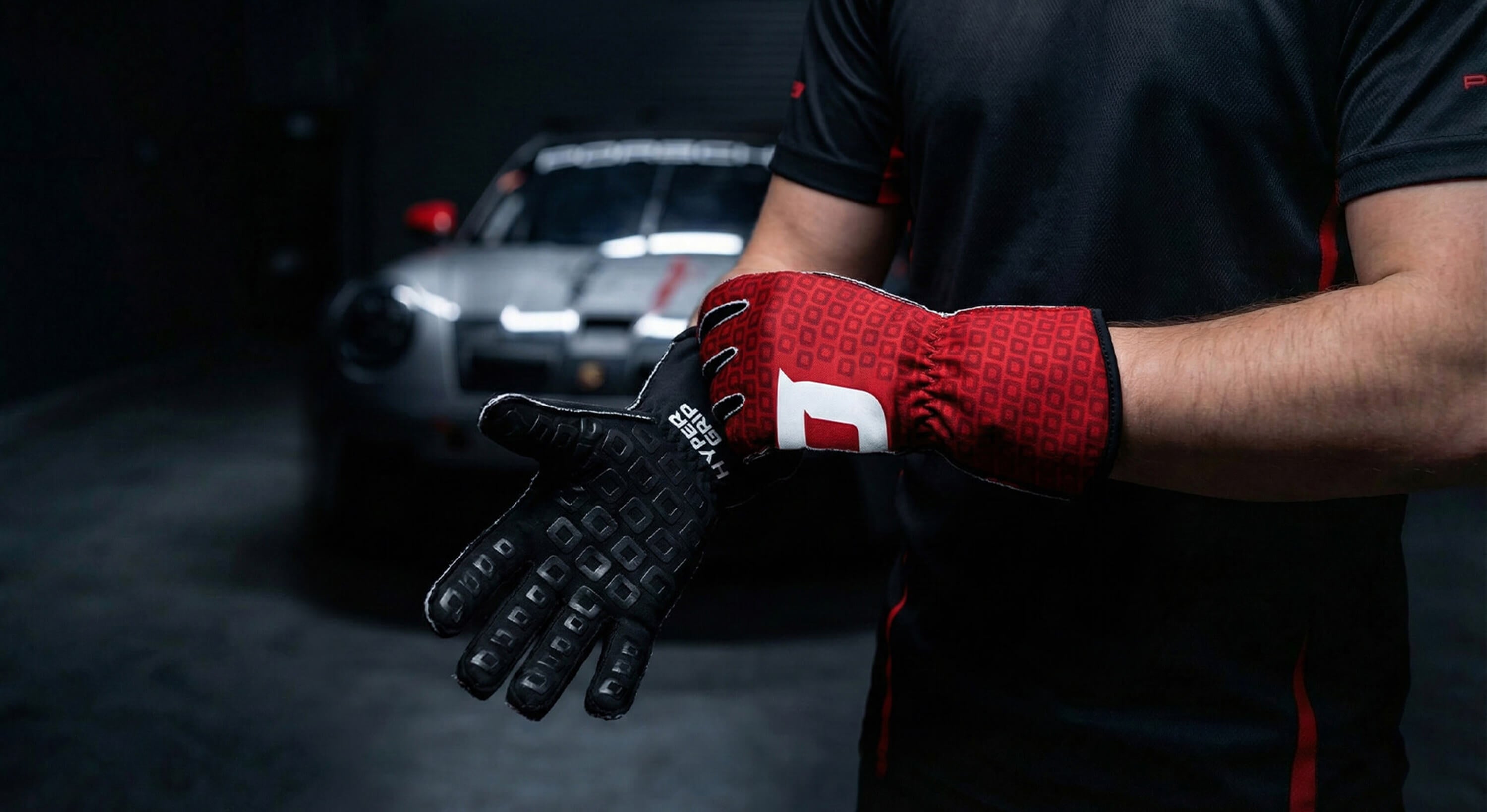 HyperGrip Scuderia sim racing gloves with black palm grip and gt3 car in studio