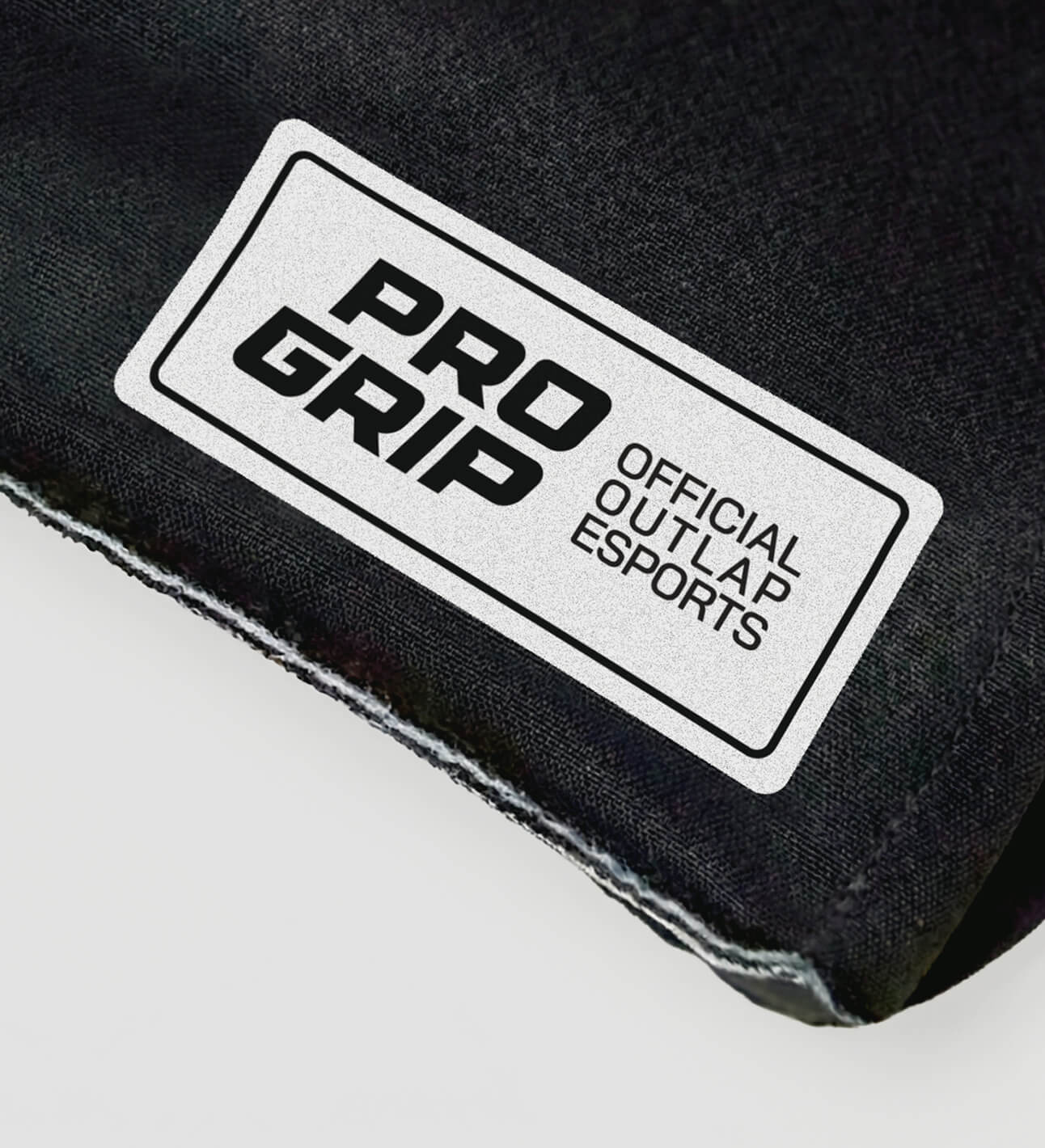 ProGrip gloves sleeve and 'Official Outlap Esports' label on a white background