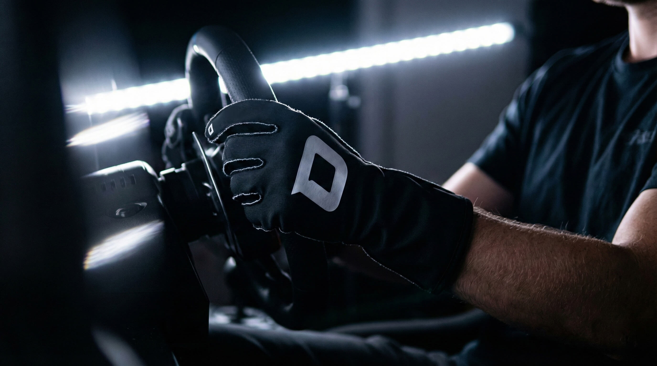 ProGrip black gloves sim racing in studio with white led in background